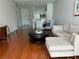 Cozy living room with hardwood floors and a sectional sofa for relaxed lounging at 443 Enclave Pl # 0, Lakeland, FL 33803