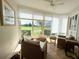 Cozy sunroom with tile floors, large windows showcasing the golf course, and comfortable seating at 443 Enclave Pl # 0, Lakeland, FL 33803
