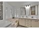 Bright bathroom features a large vanity and tub at 451 Village Sw Cir, Winter Haven, FL 33880