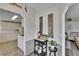 Hallway showcasing wood-look flooring and leading to the kitchen and living area at 451 Village Sw Cir, Winter Haven, FL 33880