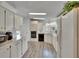 Bright kitchen with white cabinets and countertops, featuring stainless steel appliances and plenty of natural light at 451 Village Sw Cir, Winter Haven, FL 33880