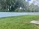 Spacious fenced backyard with mature trees offering privacy and ample green space at 4665 Sw 40Th Pl, Ocala, FL 34474