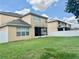 A home's backyard features a screen porch and white fence, perfect for entertaining at 4665 Sw 40Th Pl, Ocala, FL 34474