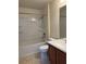 Bright bathroom features a tub, shower, toilet, and vanity with cabinets at 4665 Sw 40Th Pl, Ocala, FL 34474