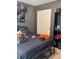 Bedroom featuring dark gray walls, closet and metal bedframe at 4665 Sw 40Th Pl, Ocala, FL 34474