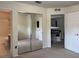 Bedroom with closet, carpeting, and ensuite bathroom with tiled floor at 4665 Sw 40Th Pl, Ocala, FL 34474