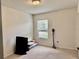 Cozy bedroom with neutral carpet, window with blinds, and ample natural light at 4665 Sw 40Th Pl, Ocala, FL 34474