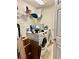 The bright laundry room features a washer, dryer, and storage shelves at 4665 Sw 40Th Pl, Ocala, FL 34474
