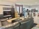 Spacious living room featuring an open floorplan, lots of natural light, and connection to the kitchen at 4665 Sw 40Th Pl, Ocala, FL 34474