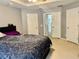 Main bedroom featuring multiple closets, neutral color scheme and tray ceiling at 4665 Sw 40Th Pl, Ocala, FL 34474