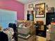 Office featuring bright pink accent wall, and plenty of boxes at 4665 Sw 40Th Pl, Ocala, FL 34474