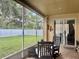 Enjoy this screened lanai with a view of the backyard and a fire pit at 4665 Sw 40Th Pl, Ocala, FL 34474