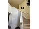 Carpeted staircase with a white banister and a modern design at 4665 Sw 40Th Pl, Ocala, FL 34474