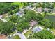 An aerial view of the home shows mature landscaping on a quiet street at 4720 Wildflower Dr Dr, Lakeland, FL 33811