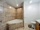 Bathroom showcasing a tiled shower with tub and tiled floors at 4720 Wildflower Dr Dr, Lakeland, FL 33811