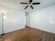 Bedroom featuring wood floor, ceiling fan, and door frame at 4720 Wildflower Dr Dr, Lakeland, FL 33811