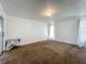 A spacious bedroom with a window and glass doors to outside at 4720 Wildflower Dr Dr, Lakeland, FL 33811