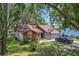 Attractive home showcasing the garage, shutters, landscaping, and front door at 4720 Wildflower Dr Dr, Lakeland, FL 33811