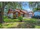 Charming single-Gathering home featuring a well-maintained lawn and mature trees at 4720 Wildflower Dr Dr, Lakeland, FL 33811