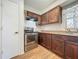 Kitchen with stainless steel oven, vent hood, and wood cabinets at 4720 Wildflower Dr Dr, Lakeland, FL 33811