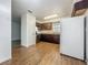 View of kitchen with wood floor and white refrigerator at 4720 Wildflower Dr Dr, Lakeland, FL 33811