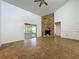 Open-concept living room with a ceiling fan and natural light from sliding glass doors at 4720 Wildflower Dr Dr, Lakeland, FL 33811