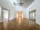 Spacious living room with vaulted ceilings and tile floors, bathed in natural light at 4720 Wildflower Dr Dr, Lakeland, FL 33811