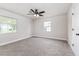 Bedroom with ceiling fan, carpet, two windows and white trim at 508 Boger N Blvd, Lakeland, FL 33803