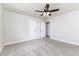 Spacious bedroom with carpet, neutral walls, ceiling fan, and doors at 508 Boger N Blvd, Lakeland, FL 33803