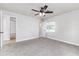 Cozy bedroom with carpet, white walls, closet, and a ceiling fan at 508 Boger N Blvd, Lakeland, FL 33803