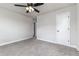 Bedroom featuring carpet, ceiling fan, neutral walls, and a doorway at 508 Boger N Blvd, Lakeland, FL 33803