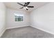 Bedroom with carpet, white trim, a ceiling fan, and a window at 508 Boger N Blvd, Lakeland, FL 33803