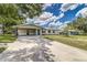 Charming home with a long driveway and covered carport providing ample parking at 508 Boger N Blvd, Lakeland, FL 33803