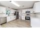 Bright kitchen with stainless steel appliances, subway tile backsplash, and new white cabinets at 508 Boger N Blvd, Lakeland, FL 33803