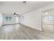 Bright living room with new floors, fresh paint, a ceiling fan, and lots of natural light at 508 Boger N Blvd, Lakeland, FL 33803