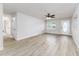 Bright living room features new floors, fresh paint, a ceiling fan, and lots of natural light at 508 Boger N Blvd, Lakeland, FL 33803