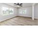 Cozy living room features new floors, fresh paint, a ceiling fan, and lots of natural light at 508 Boger N Blvd, Lakeland, FL 33803
