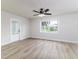Inviting living room features new floors, fresh paint, a ceiling fan, and lots of natural light at 508 Boger N Blvd, Lakeland, FL 33803