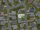 An aerial view of the house showcases its location in a well-landscaped neighborhood at 5771 Macaw Pl, Lakeland, FL 33809