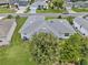 Aerial view of house, showing roof, back yard, and surrounding neighborhood at 5771 Macaw Pl, Lakeland, FL 33809