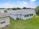 Exterior shot of house featuring a well-maintained lawn and an AC unit at 5771 Macaw Pl, Lakeland, FL 33809