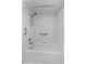 Bathroom featuring a white tub with a shower and a metal grab bar at 5771 Macaw Pl, Lakeland, FL 33809