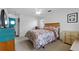 Comfortable bedroom with carpet, ceiling fan, and coordinating furniture at 5771 Macaw Pl, Lakeland, FL 33809
