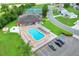 Overhead view of a stunning community pool with plentiful seating, spa, and nearby parking at 5771 Macaw Pl, Lakeland, FL 33809