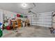 Spacious garage filled with storage boxes, shelving, and other assorted items at 5771 Macaw Pl, Lakeland, FL 33809