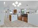 Bright, open-concept kitchen and living room with updated floors and ample natural light at 5771 Macaw Pl, Lakeland, FL 33809