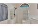 Clean bathroom featuring a walk-in shower and bright natural light from the window at 5819 Hollyhock Dr, Lakeland, FL 33813
