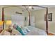 A cozy bedroom featuring a beautiful four-poster bed and a neutral color scheme at 5819 Hollyhock Dr, Lakeland, FL 33813