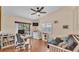 Bedroom featuring a vaulted ceiling with fan, window with blinds, a desk area and futon at 5819 Hollyhock Dr, Lakeland, FL 33813