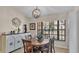 Dining room with stylish light fixture, large window and decor at 5819 Hollyhock Dr, Lakeland, FL 33813